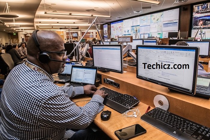 Employee with headset sitting at a desk and reviewing what is account planning