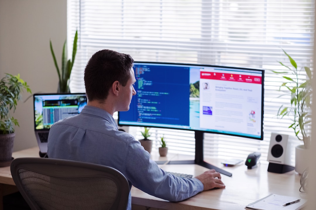 Business professional using relationship mapping software on monitor